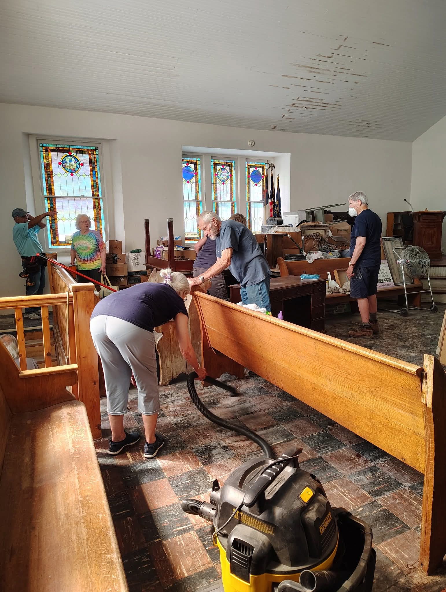 Volunteers restoring the inside of a church