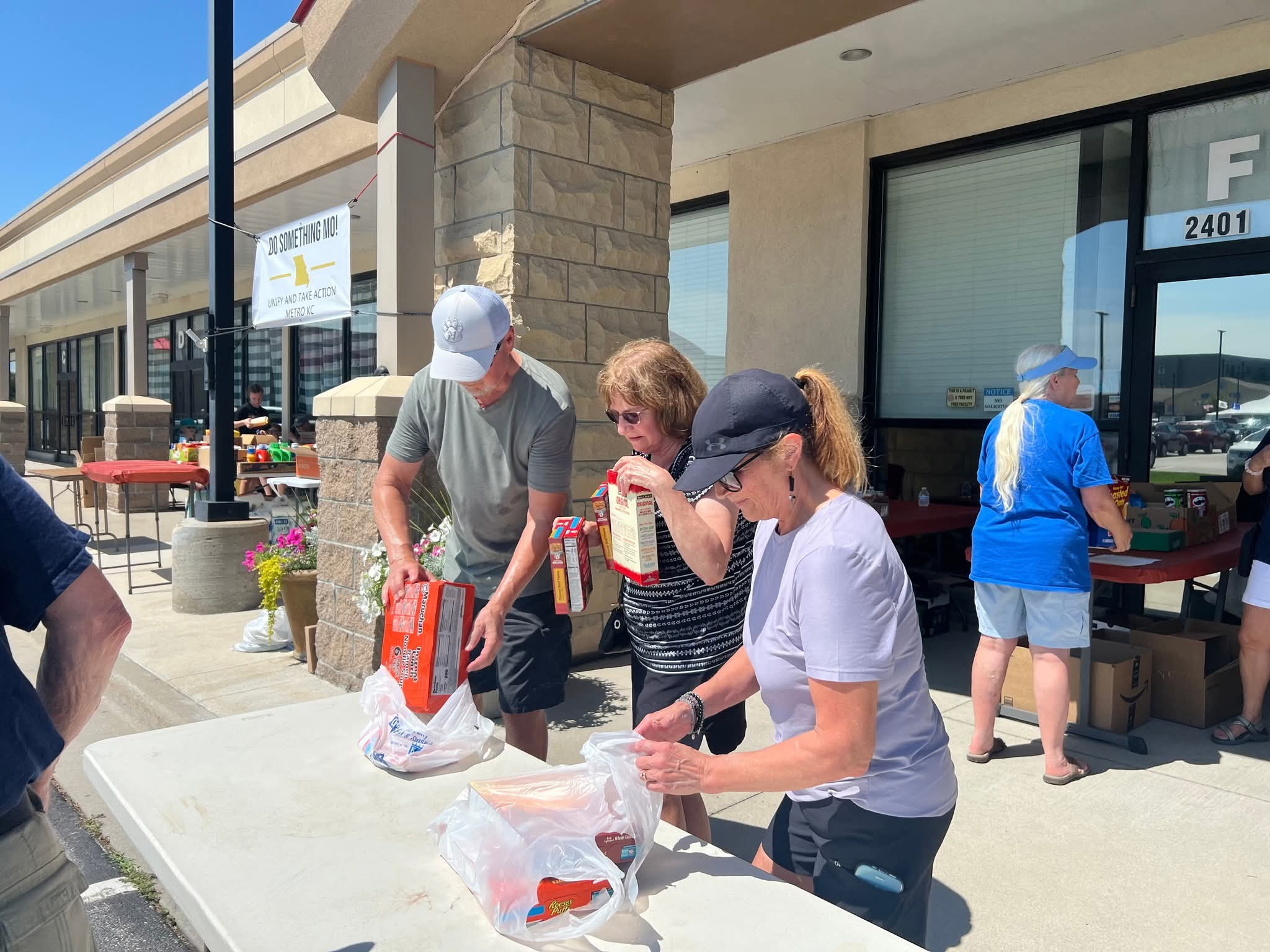 Volunteers sorting donations at a food drive